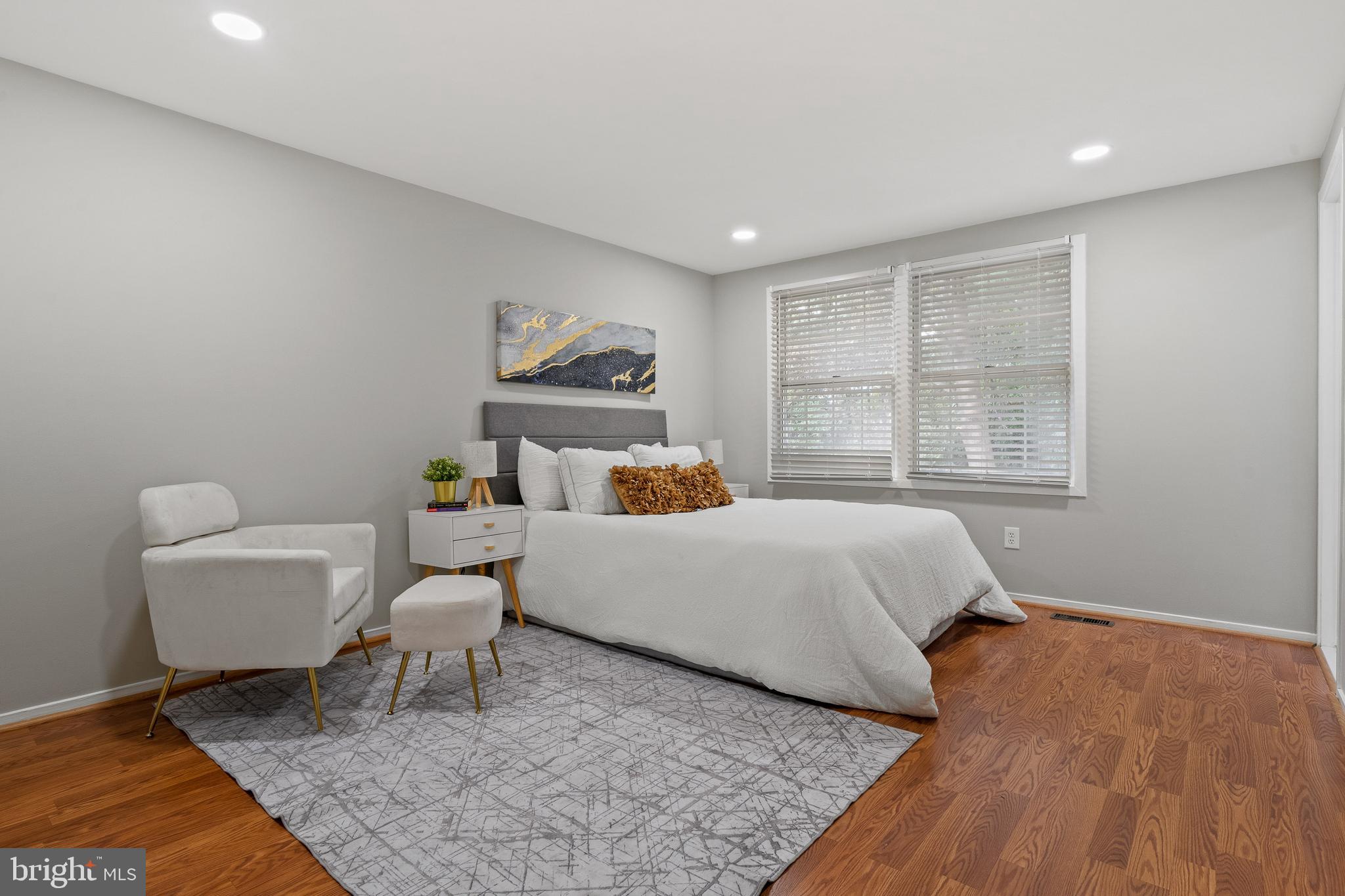 6122 Mantle Road Burke, VA 22015 - Photo 19 of 51 a bedroom with a bed and a couch