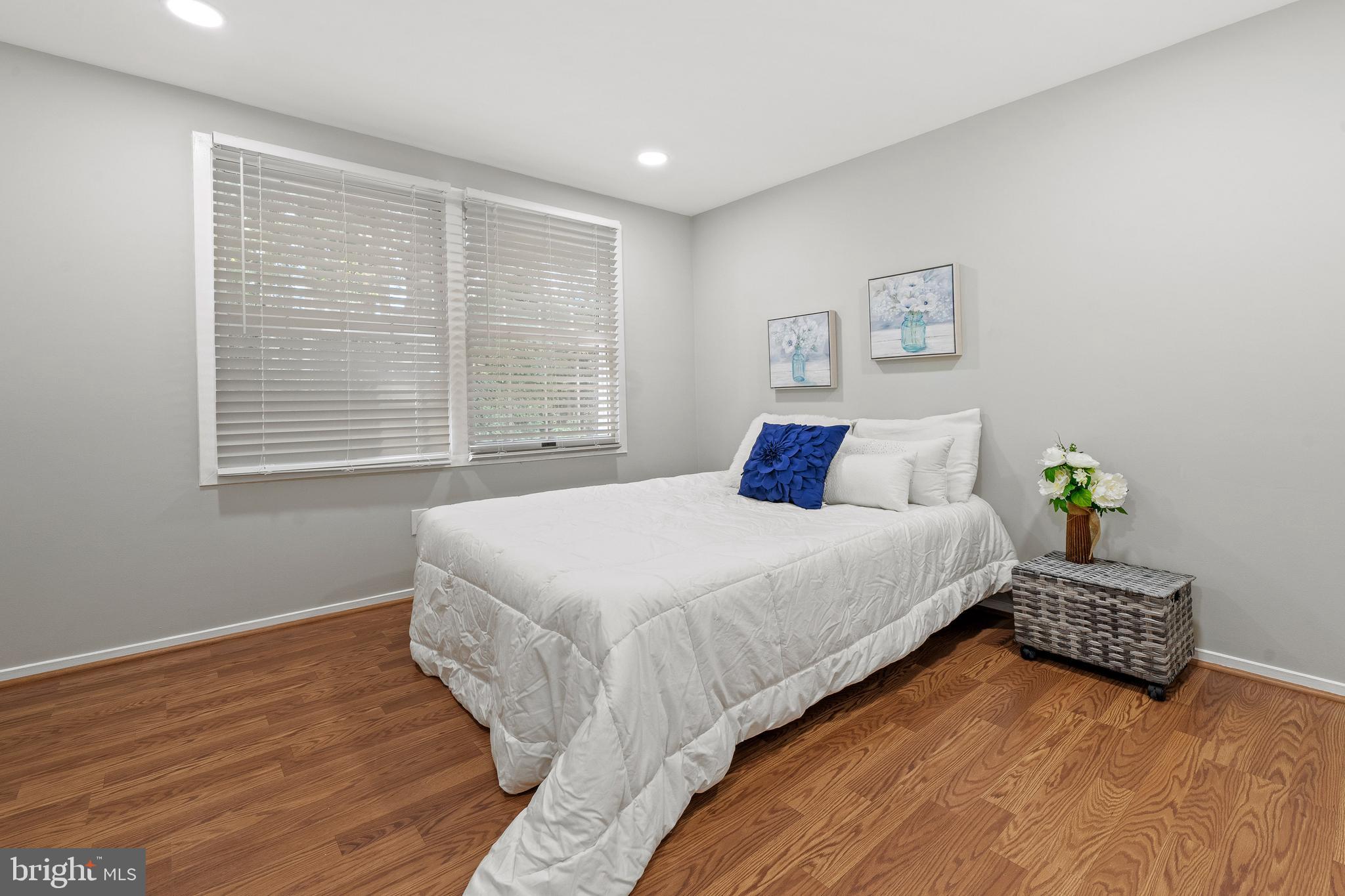 6122 Mantle Road Burke, VA 22015 - Photo 26 of 51 a bedroom with bed and a window