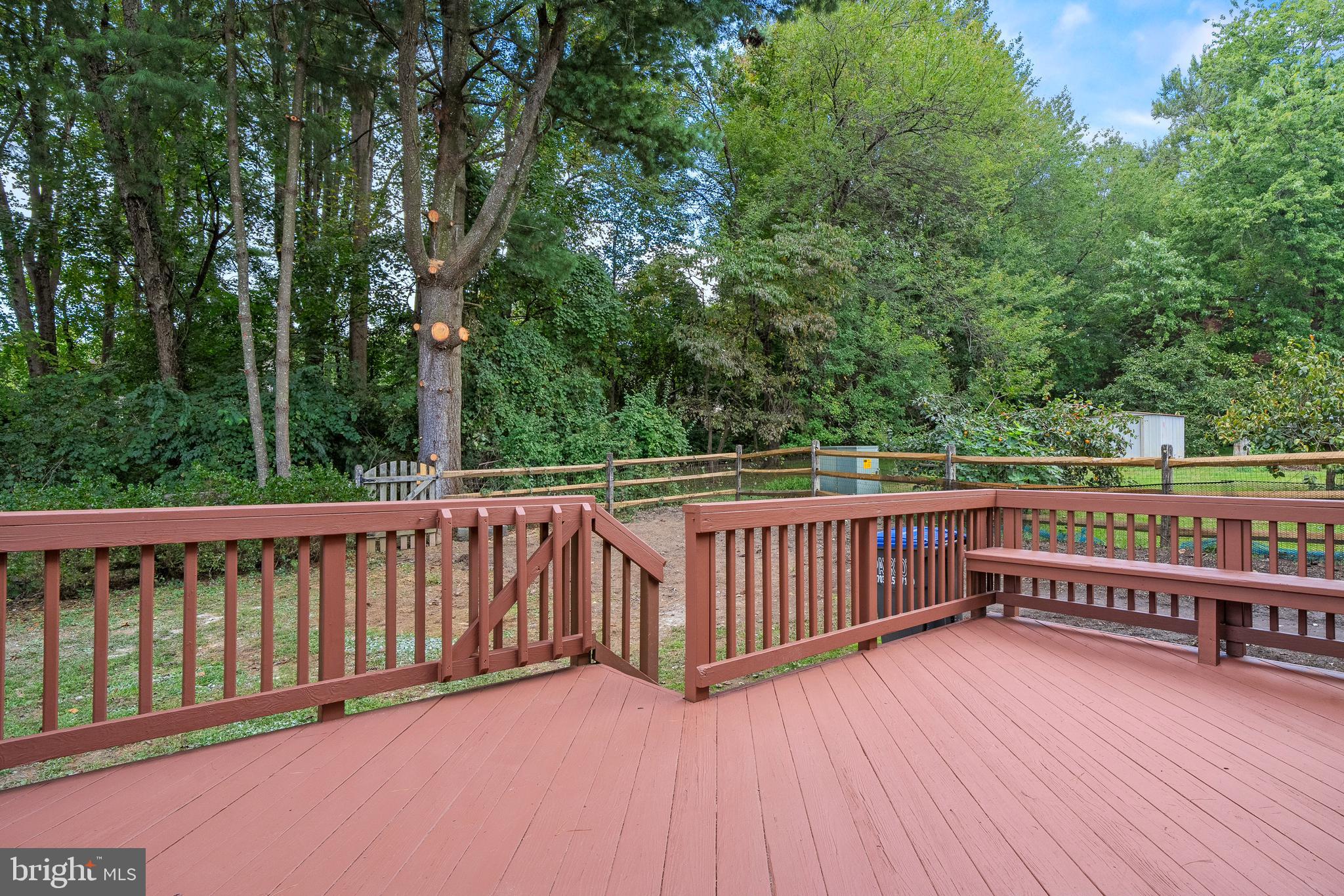 6122 Mantle Road Burke, VA 22015 - Photo 39 of 51 a view of a wooden roof deck