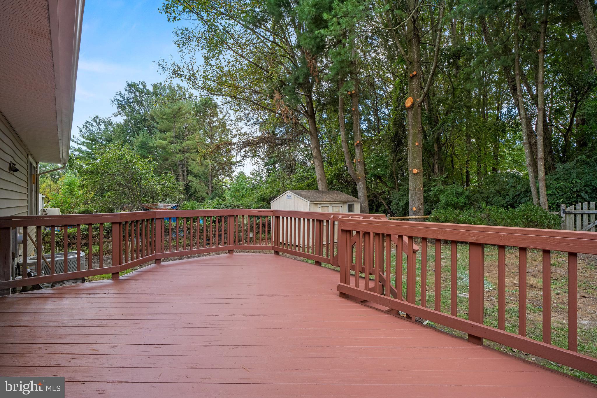 6122 Mantle Road Burke, VA 22015 - Photo 40 of 51 a view of deck with a large trees and wooden fence