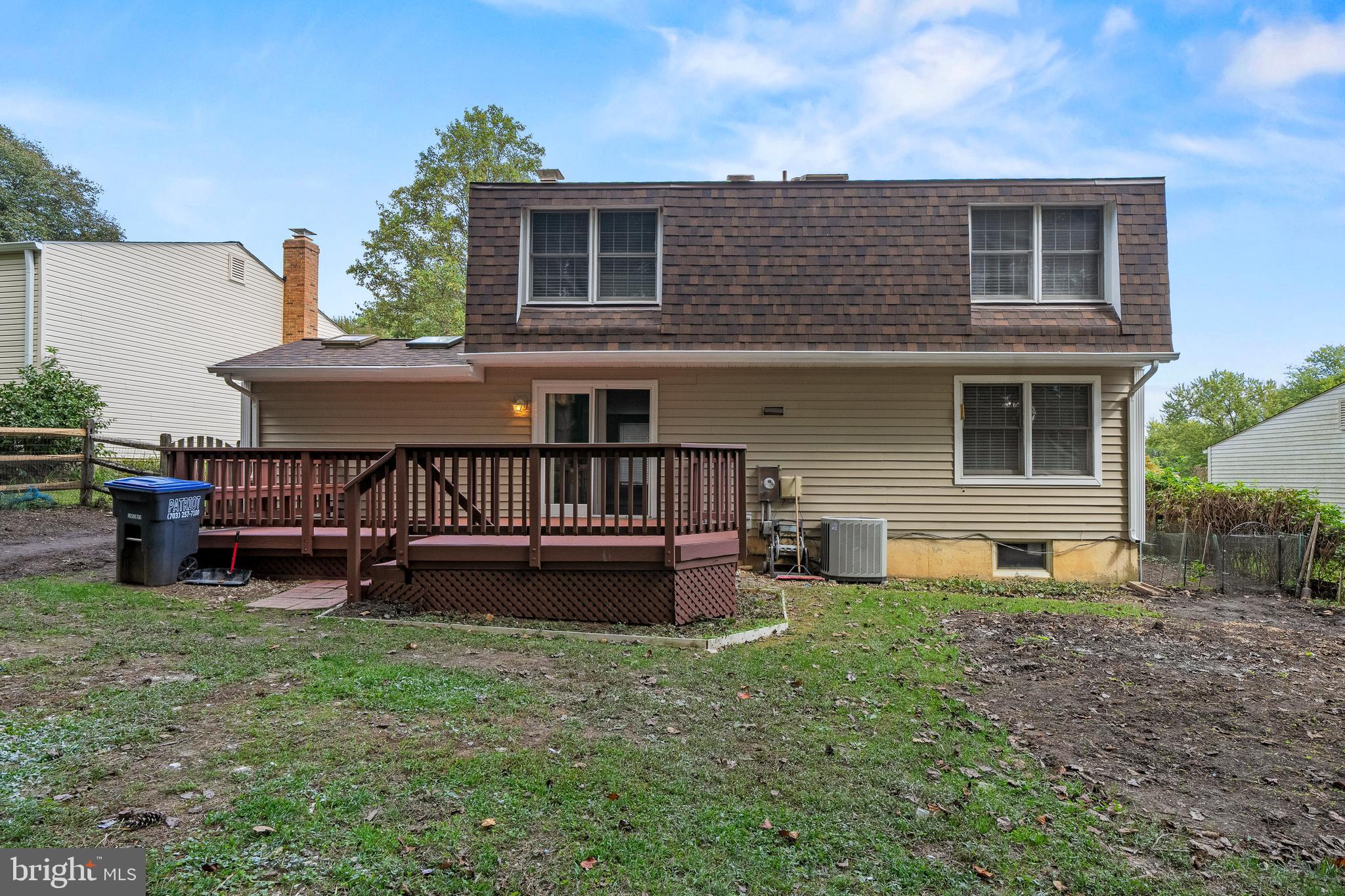 6122 Mantle Road Burke, VA 22015 - Photo 42 of 51 a backyard of a house with table and chairs