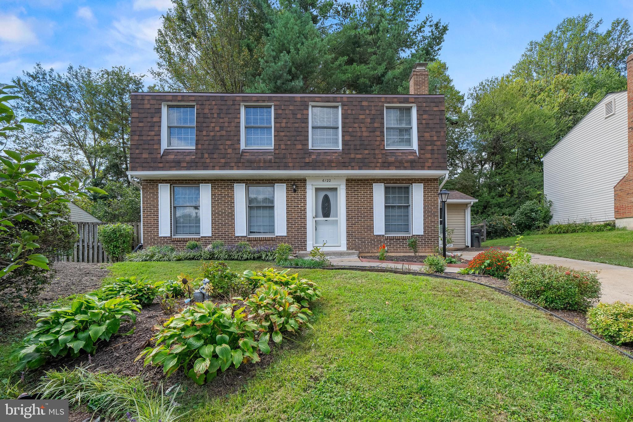 6122 Mantle Road Burke, VA 22015 - Photo 45 of 51 front view of a house with a yard