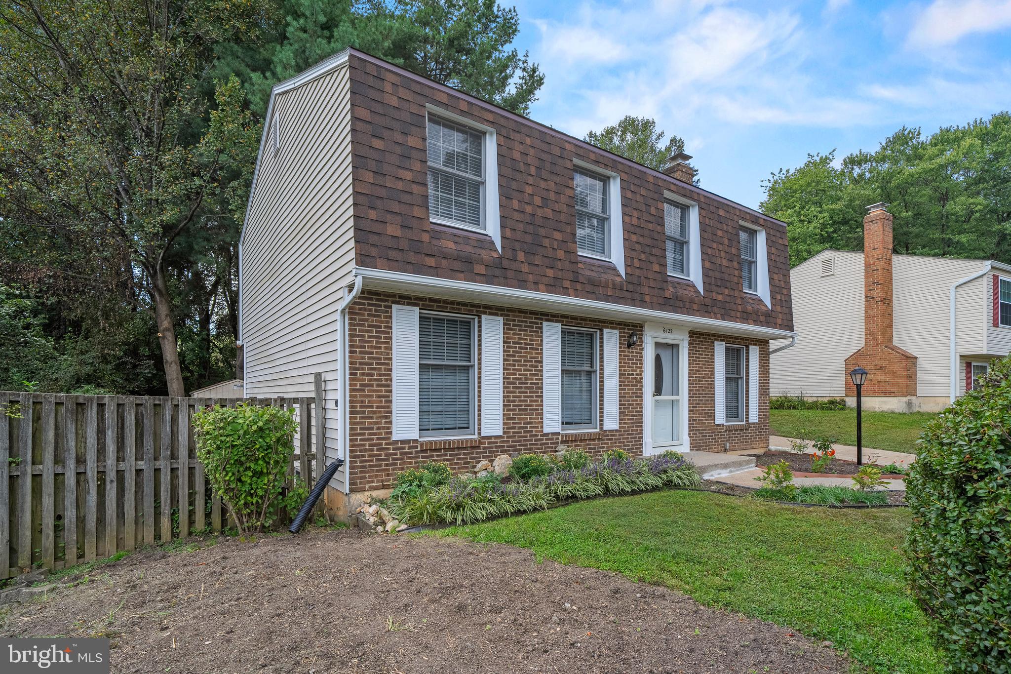 6122 Mantle Road Burke, VA 22015 - Photo 46 of 51 a front view of a house with garden
