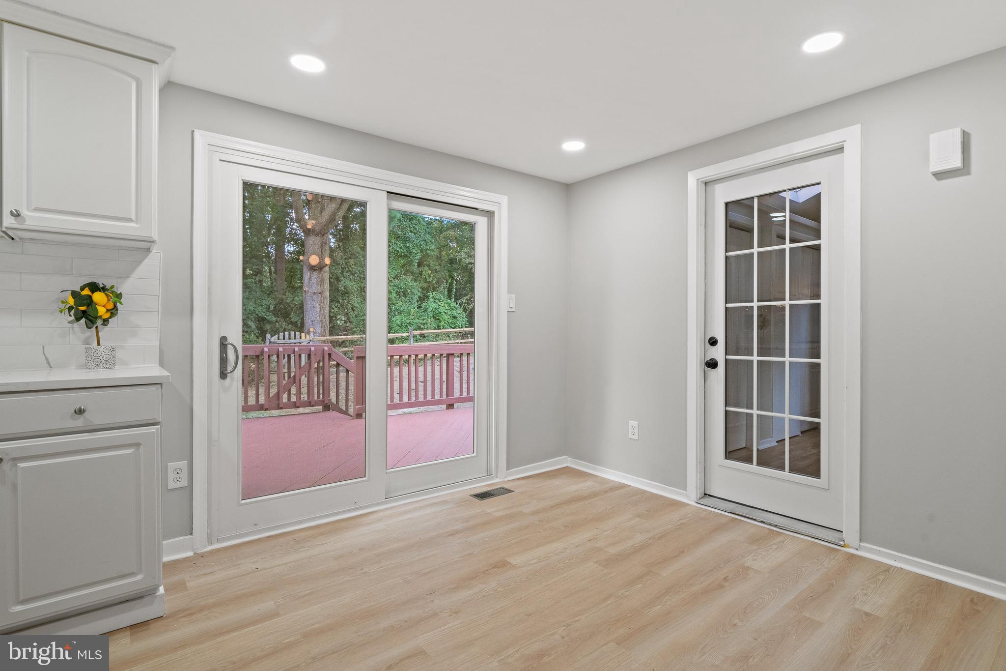 6122 Mantle Road Burke, VA 22015 - Photo 6 of 51 a view of an empty room with a window