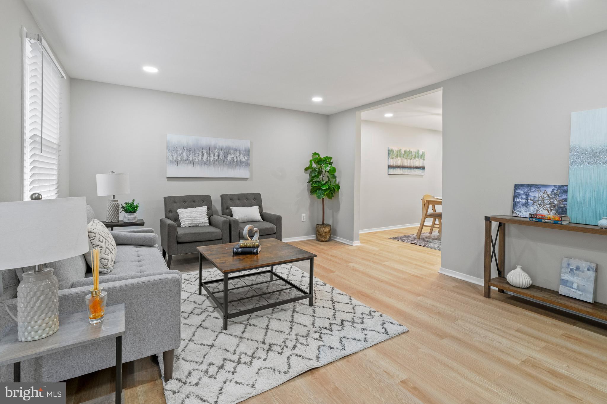 6122 Mantle Road Burke, VA 22015 - Photo 7 of 51 a living room with furniture and a wooden floor