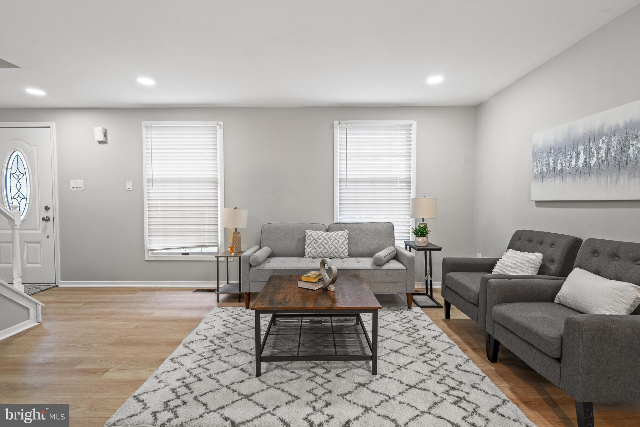 6122 Mantle Road Burke, VA 22015 - Photo 9 of 51 a living room with furniture and a rug