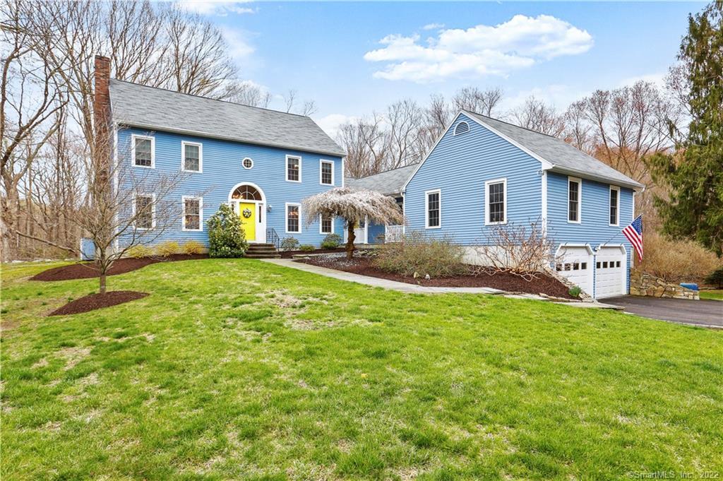 485 Judd Road Easton, CT 06612 - Photo 1 of 1 a front view of house with yard and trees in the background
