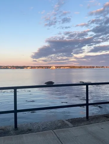 a view of an ocean beach and city