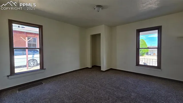 an empty room with windows