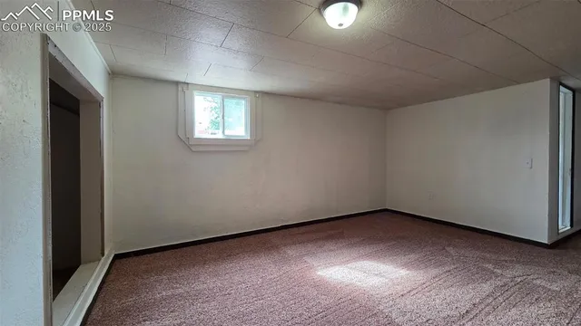 an empty room with a empty space and windows