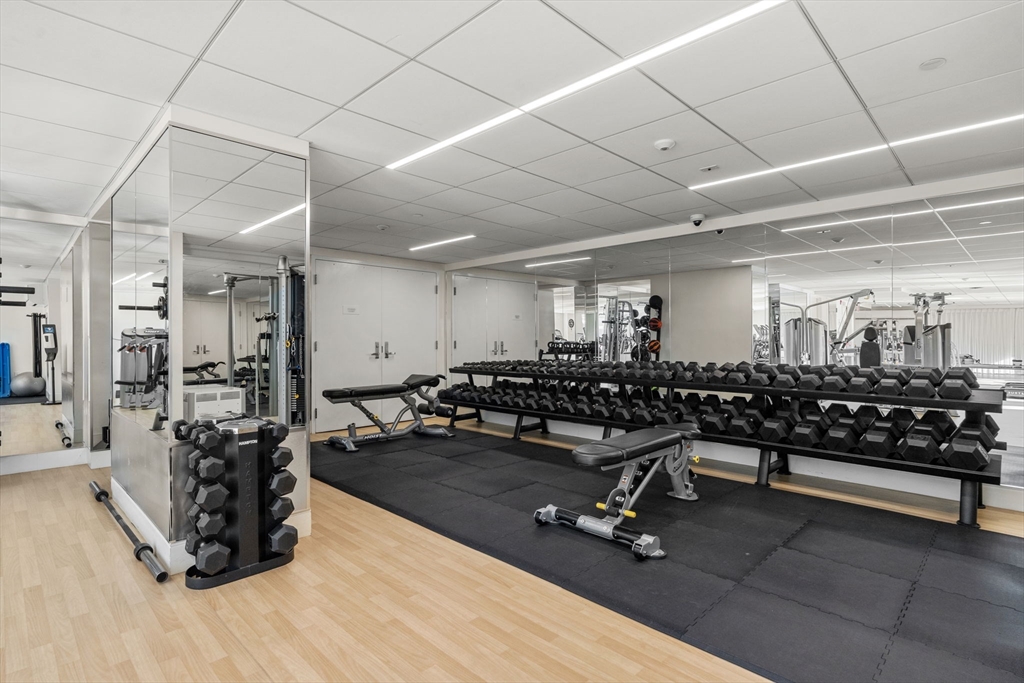 151 Tremont Street, Unit 10S Boston, MA 02111 - Photo 21 of 27 a view of a room with gym equipment