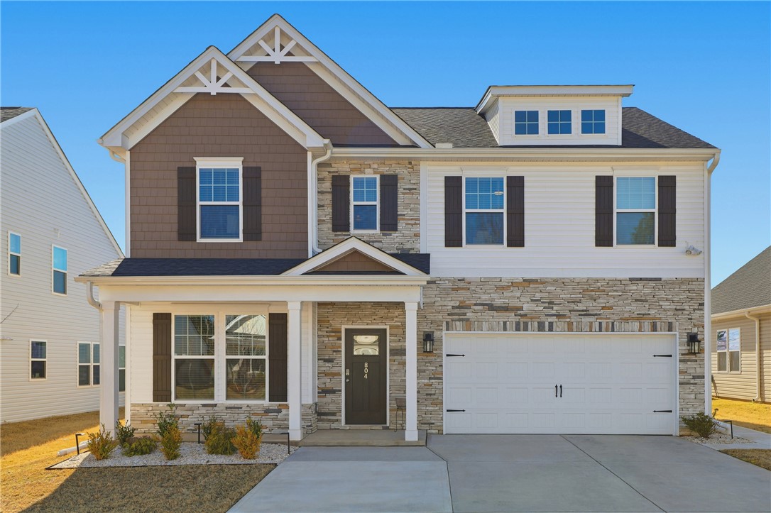 This newly constructed home boasts charming architectural details and a welcoming curb appeal.