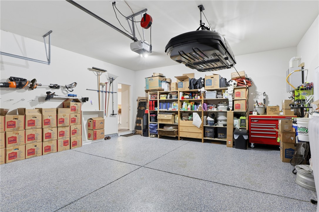 804 Spring Orchard Drive Lyman, SC 29365 - Photo 12 of 47 This spacious garage with Epoxy-coated garage floors offers ample storage solutions and convenient access for all your needs.