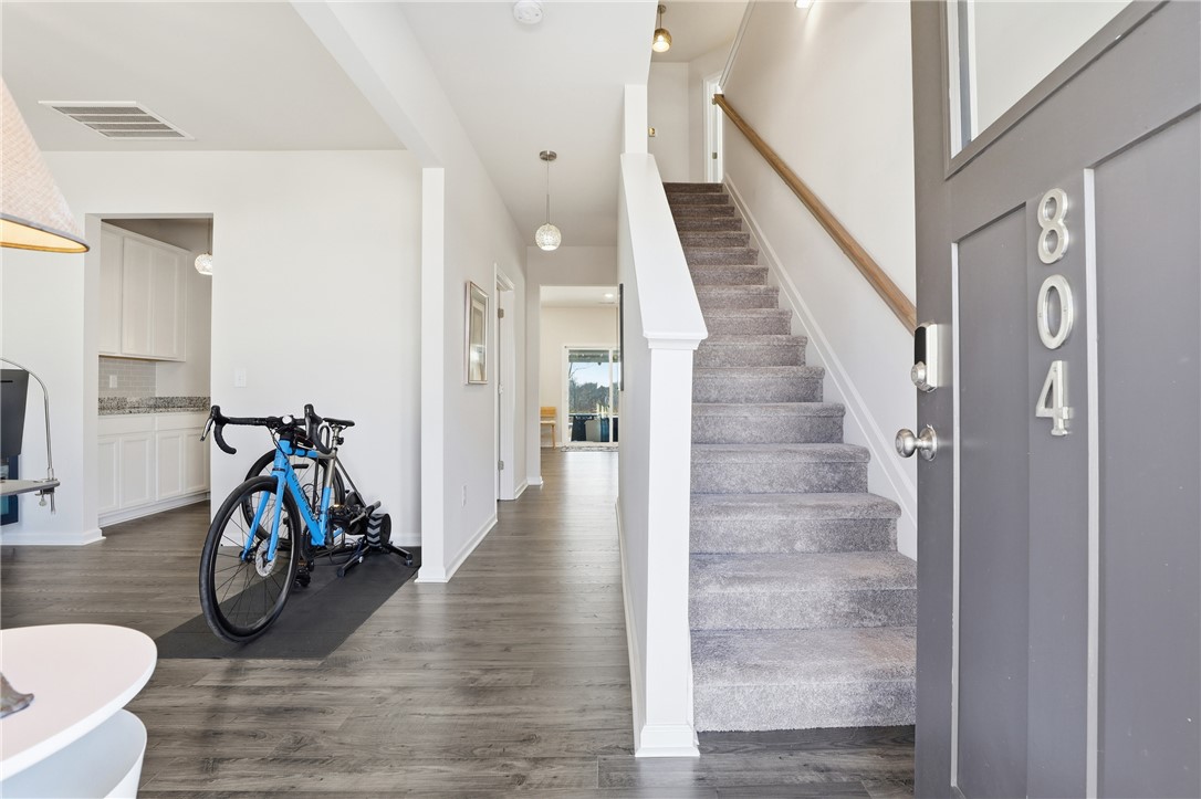 804 Spring Orchard Drive Lyman, SC 29365 - Photo 14 of 47 Enter into a welcoming entryway featuring a staircase and modern flooring.
