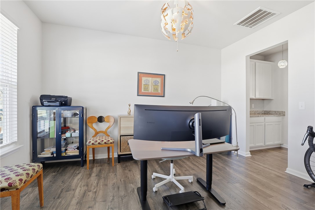 804 Spring Orchard Drive Lyman, SC 29365 - Photo 15 of 47 An inviting home office, bathed in natural light, offers an ideal environment for productivity with upgraded lighting fixutures.