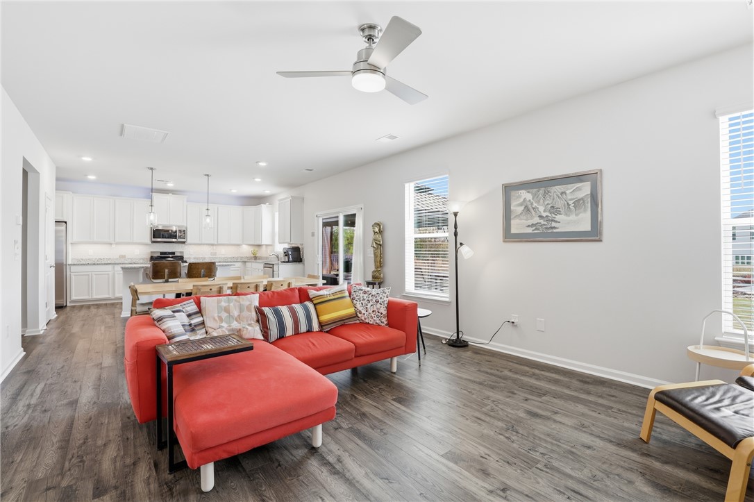 804 Spring Orchard Drive Lyman, SC 29365 - Photo 18 of 47 This open-concept living space features stylish LVP flooring and ample natural light.