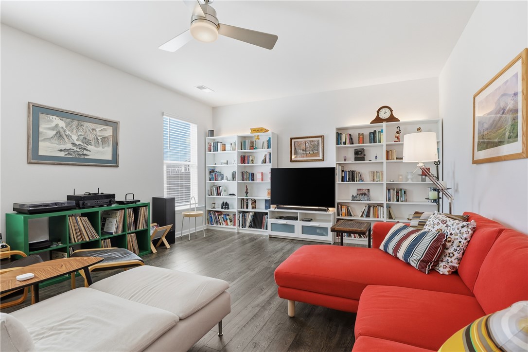 804 Spring Orchard Drive Lyman, SC 29365 - Photo 18 of 47 This inviting living space features an open layout with beautifully lit cabinetry, creating a warm and welcoming atmosphere for everyday living and entertaining.
