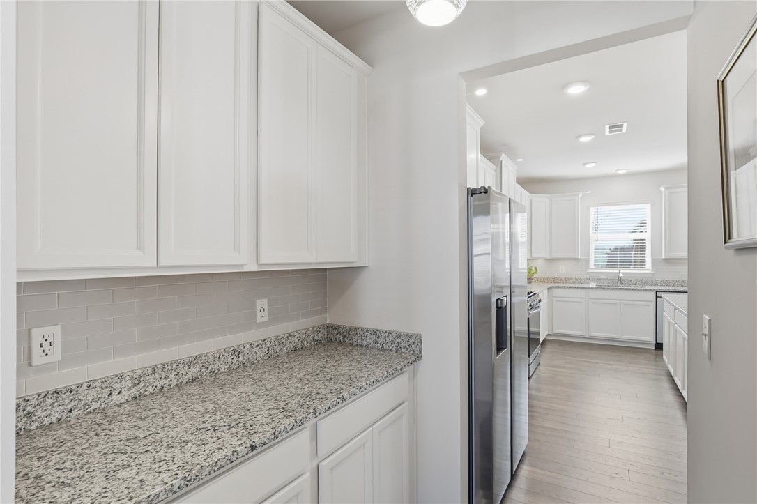 804 Spring Orchard Drive Lyman, SC 29365 - Photo 19 of 47 Custom upgraded tile backsplash — a beautiful step above builder-grade finishes.