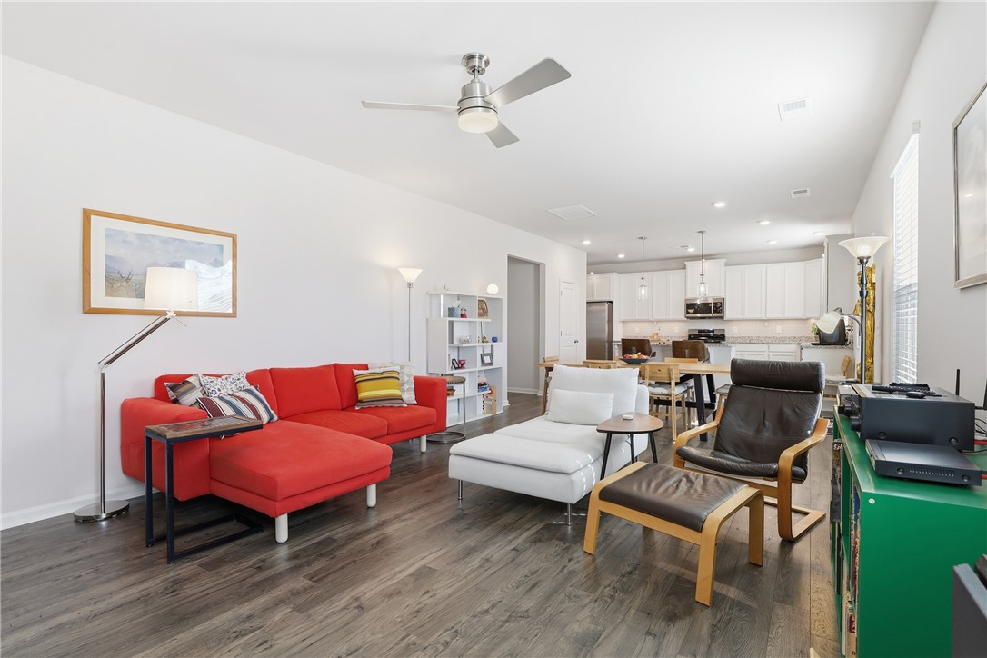 804 Spring Orchard Drive Lyman, SC 29365 - Photo 19 of 47 Bright and airy open-concept living space with sleek flooring seamlessly connects to the kitchen.