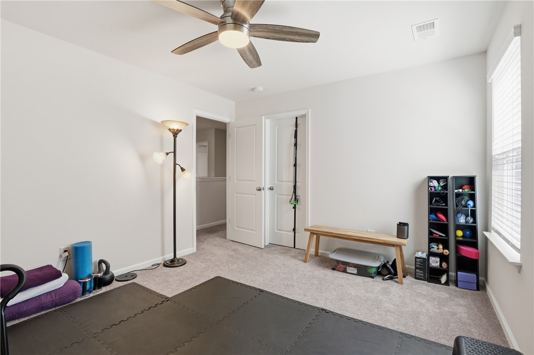 804 Spring Orchard Drive Lyman, SC 29365 - Photo 34 of 47 This versatile room features plush carpeting, perfect for a home gym or additional living space.