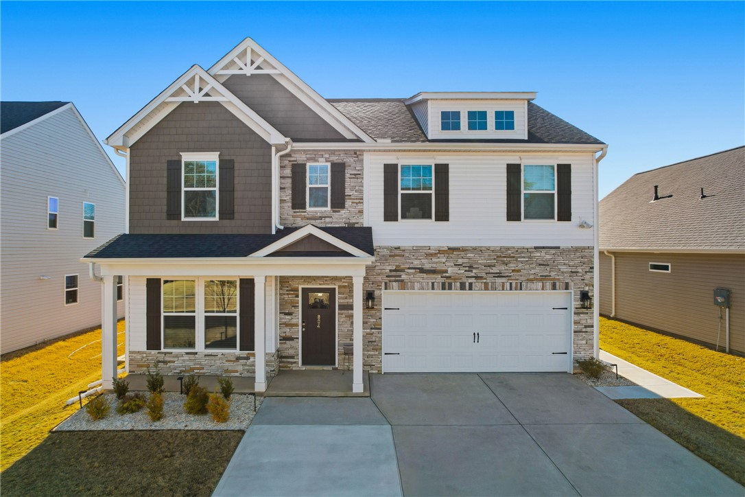 804 Spring Orchard Drive Lyman, SC 29365 - Photo 35 of 47 This newly constructed home features a charming exterior with modern architectural elements.