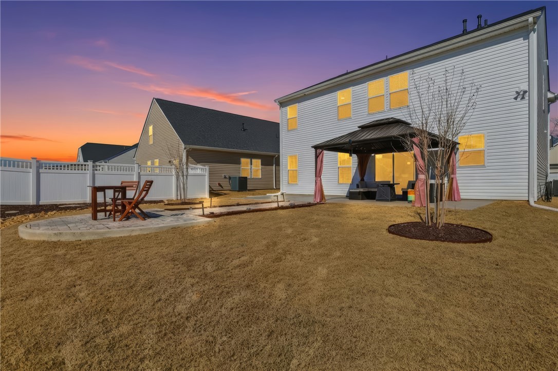 804 Spring Orchard Drive Lyman, SC 29365 - Photo 4 of 47 Thoughtfully professionally landscaped yard with added outdoor living space and irrigation!