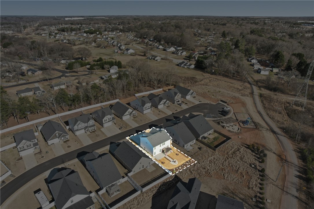 804 Spring Orchard Drive Lyman, SC 29365 - Photo 42 of 47 This aerial view showcases a residential community with contemporary homes and undeveloped land.