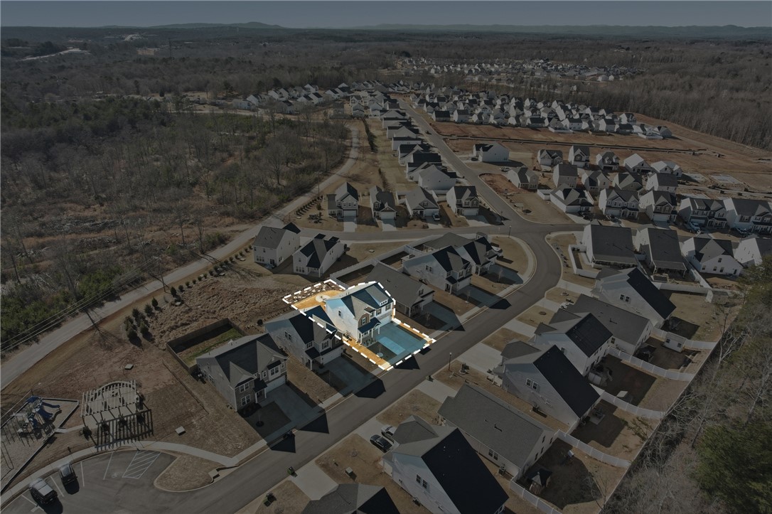 804 Spring Orchard Drive Lyman, SC 29365 - Photo 44 of 47 An aerial view captures a vibrant neighborhood featuring modern homes and a community playground.