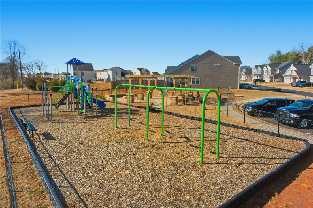 804 Spring Orchard Drive Lyman, SC 29365 - Photo 44 of 47 This community playground offers recreation for all ages, surrounded by residential homes.