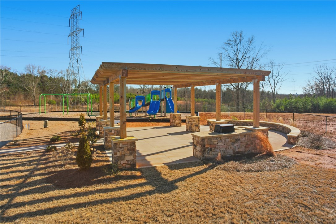 804 Spring Orchard Drive Lyman, SC 29365 - Photo 45 of 47 This inviting outdoor space features a spacious pergola, perfect for relaxation and gatherings.