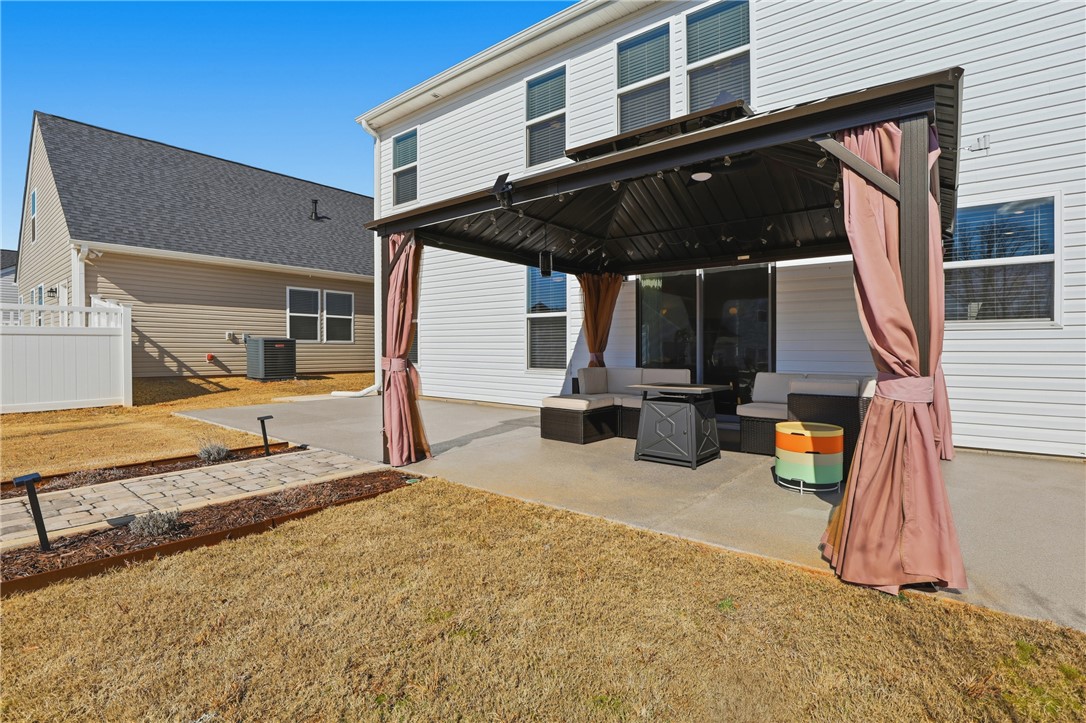 804 Spring Orchard Drive Lyman, SC 29365 - Photo 6 of 47 Relax in this inviting backyard featuring a private patio, perfect for outdoor living and entertaining.