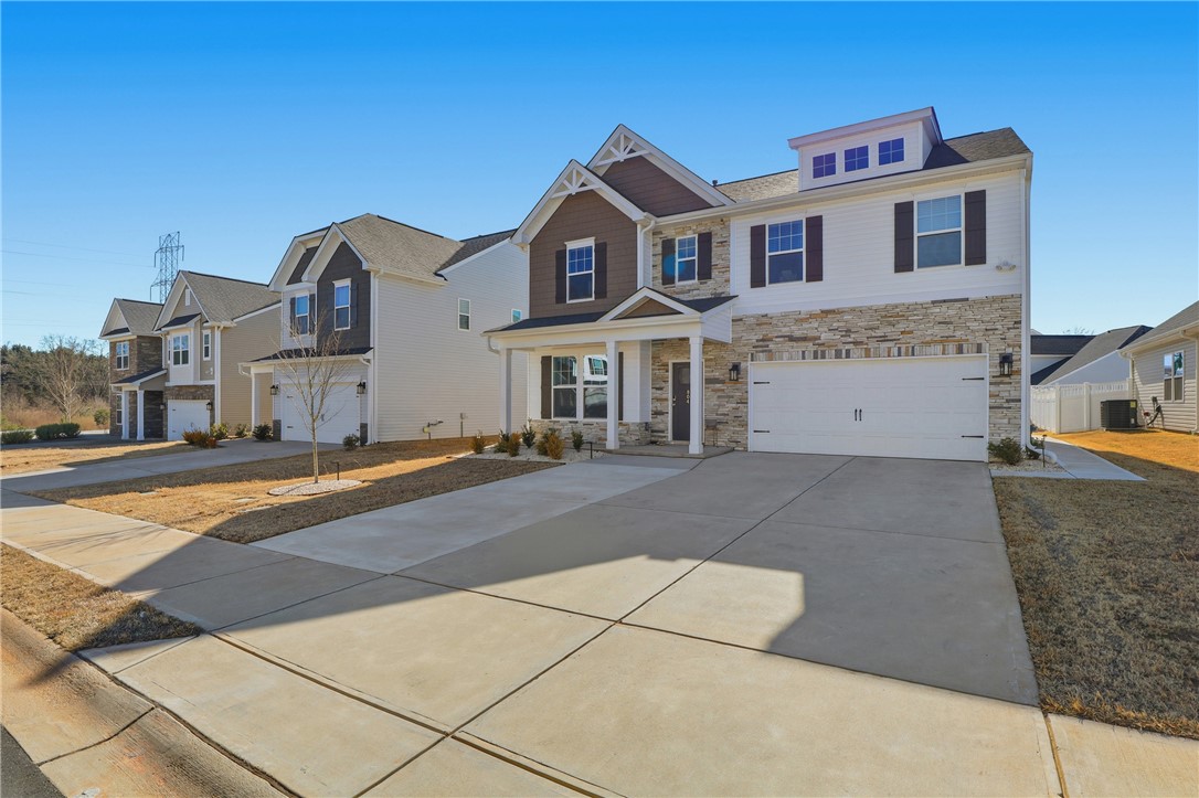 804 Spring Orchard Drive Lyman, SC 29365 - Photo 9 of 47 Additional parking pad added — convenient extra space for guests or multiple vehicles.