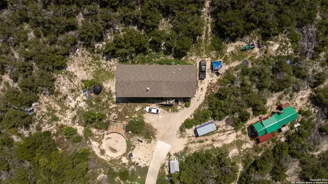 an aerial view of a house with a yard