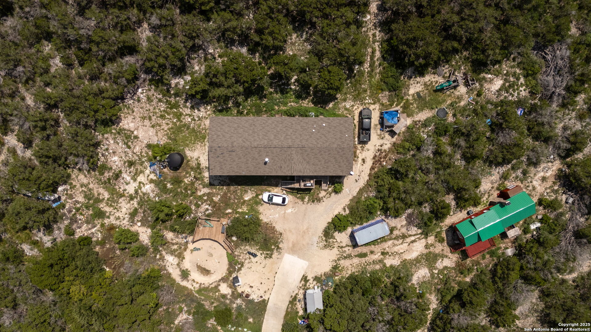 13693 Fm 1283 Mico, TX 78056 - Photo 3 of 26 an aerial view of a house with a yard