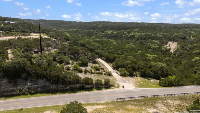 a view of a water fountain and a yard