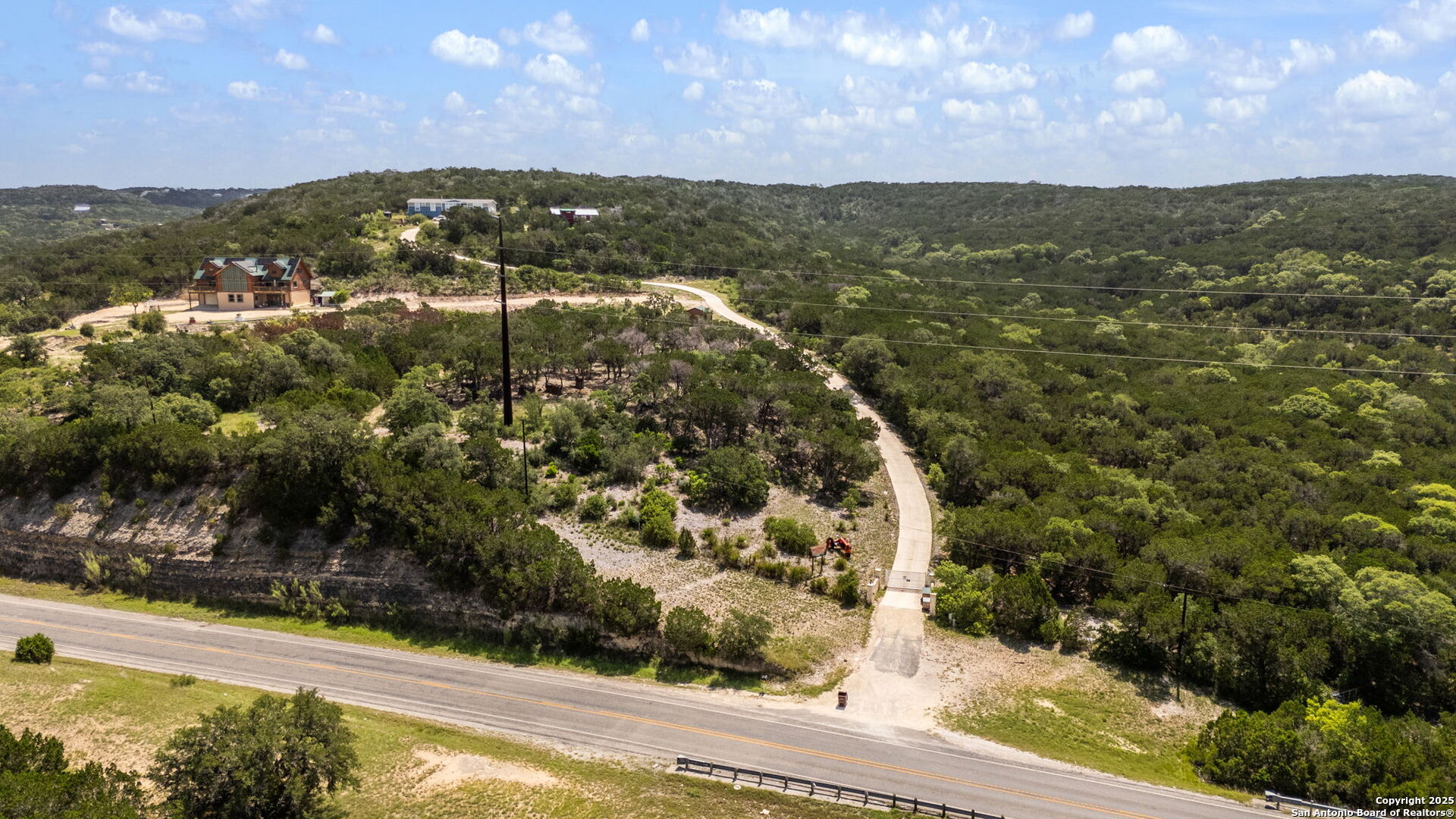 13693 Fm 1283 Mico, TX 78056 - Photo 5 of 26 a view of a lake with mountains in the background