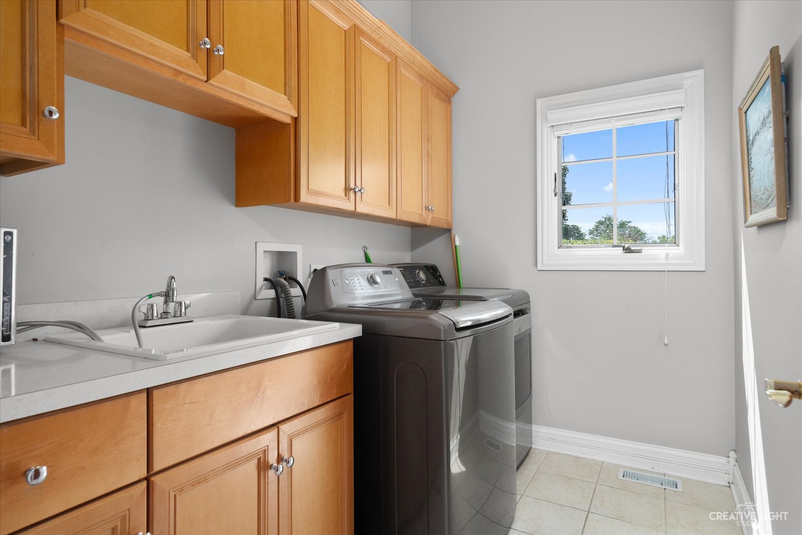 2334 Kane Lane Batavia, IL 60510 - Photo 15 of 34 a kitchen with stainless steel appliances granite countertop a sink stove and cabinets