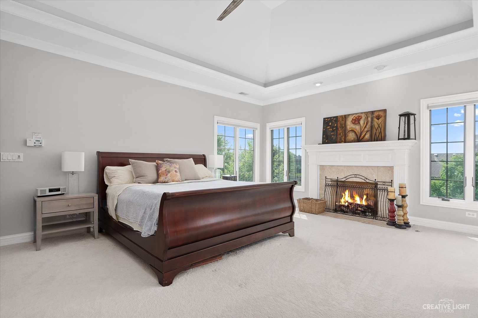 2334 Kane Lane Batavia, IL 60510 - Photo 16 of 34 a spacious bedroom with a bed and a fireplace