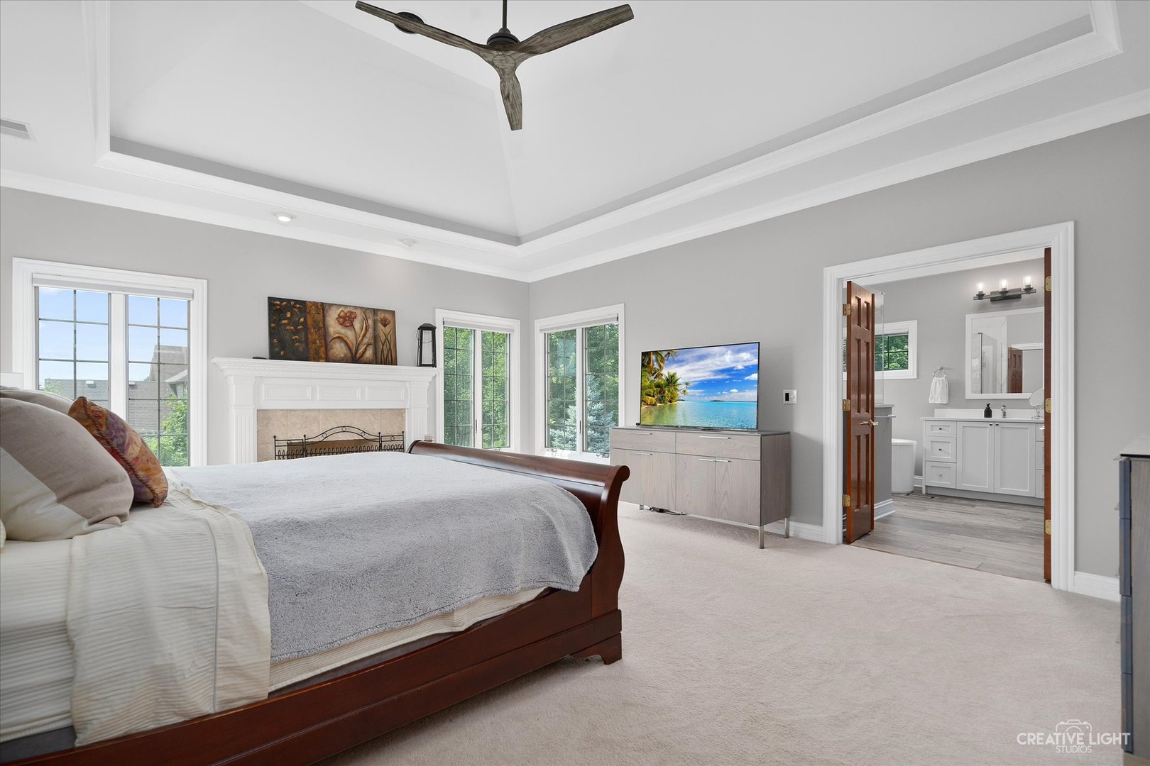 2334 Kane Lane Batavia, IL 60510 - Photo 17 of 34 a bedroom with a large bed a flat tv screen and a dresser