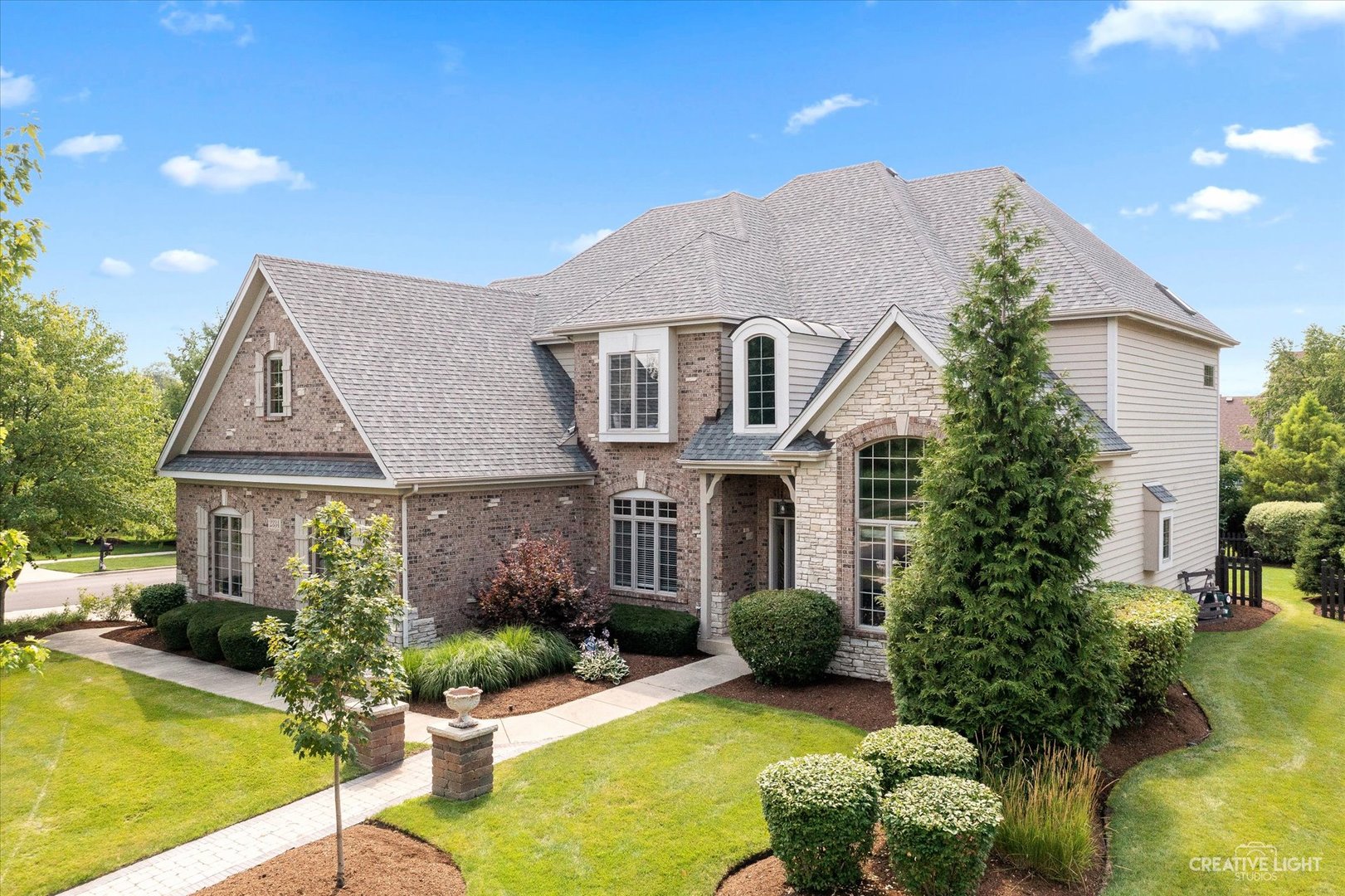 2334 Kane Lane Batavia, IL 60510 - Photo 2 of 34 a front view of a house with garden