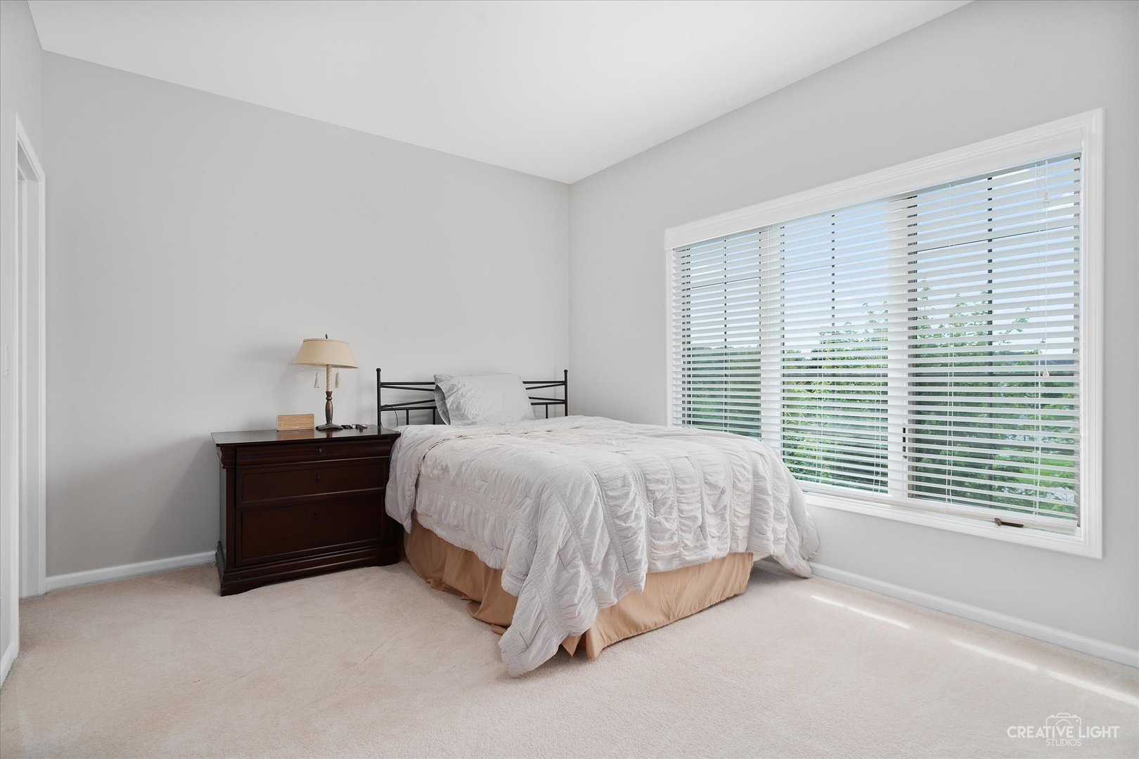 2334 Kane Lane Batavia, IL 60510 - Photo 24 of 34 a bed sitting in a bedroom next to a window