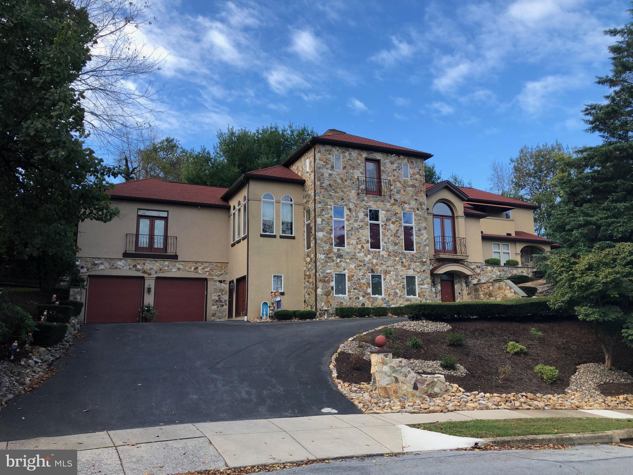 101 Robert Drive Reading, PA 19610 - Photo 11 of 118 a front view of a house with a garden