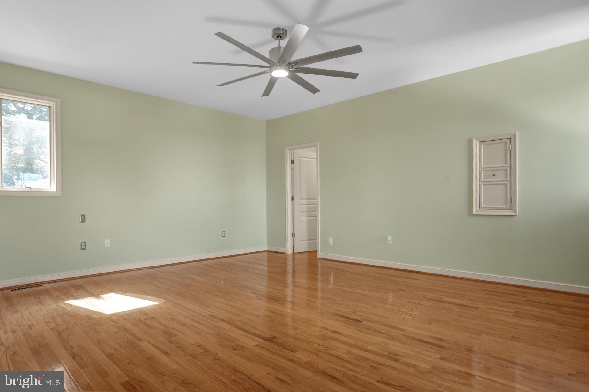 101 Robert Drive Reading, PA 19610 - Photo 101 of 118 an empty room with wooden floor and windows