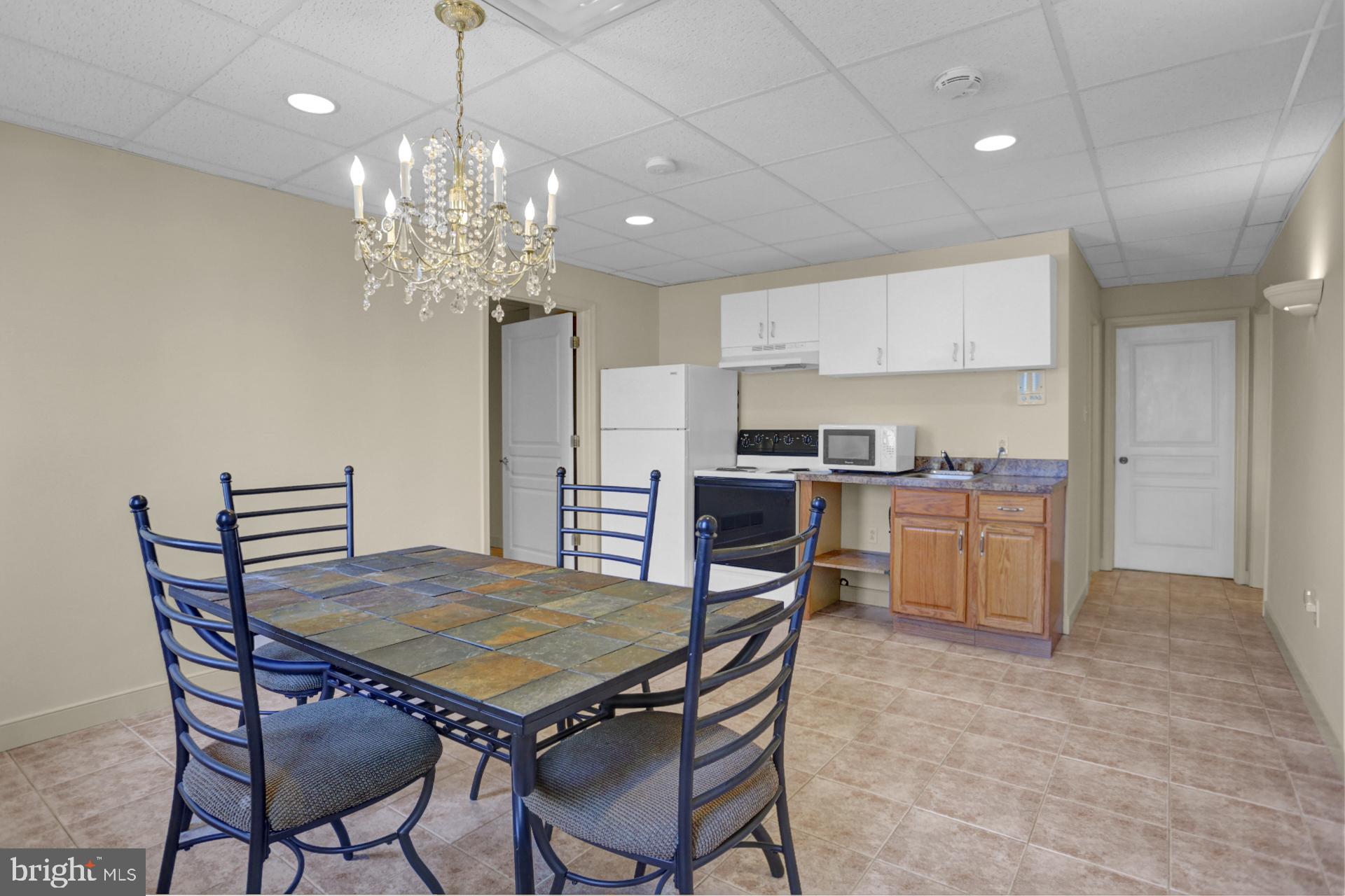 101 Robert Drive Reading, PA 19610 - Photo 110 of 118 a view of a dining room with furniture and chandelier