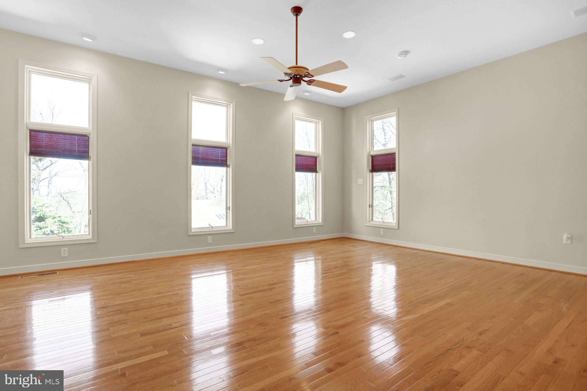 101 Robert Drive Reading, PA 19610 - Photo 69 of 118 a view of an empty room with wooden floor and a window