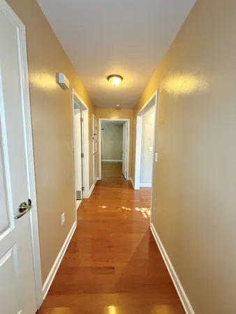 a view of hallway with livingroom