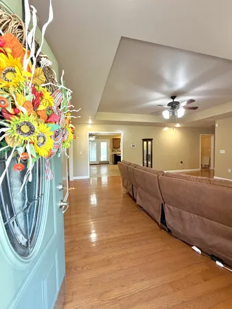 a lobby with furniture and a chandelier