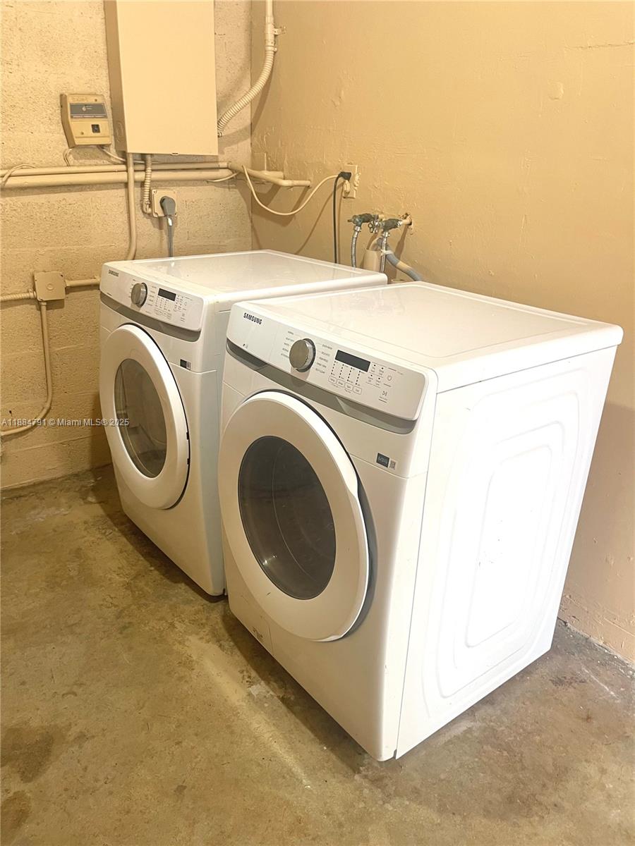 3295 Northwest 214th Street, Unit 3295 Miami Gardens, FL 33056 - Photo 19 of 19 a utility room with dryer and washer
