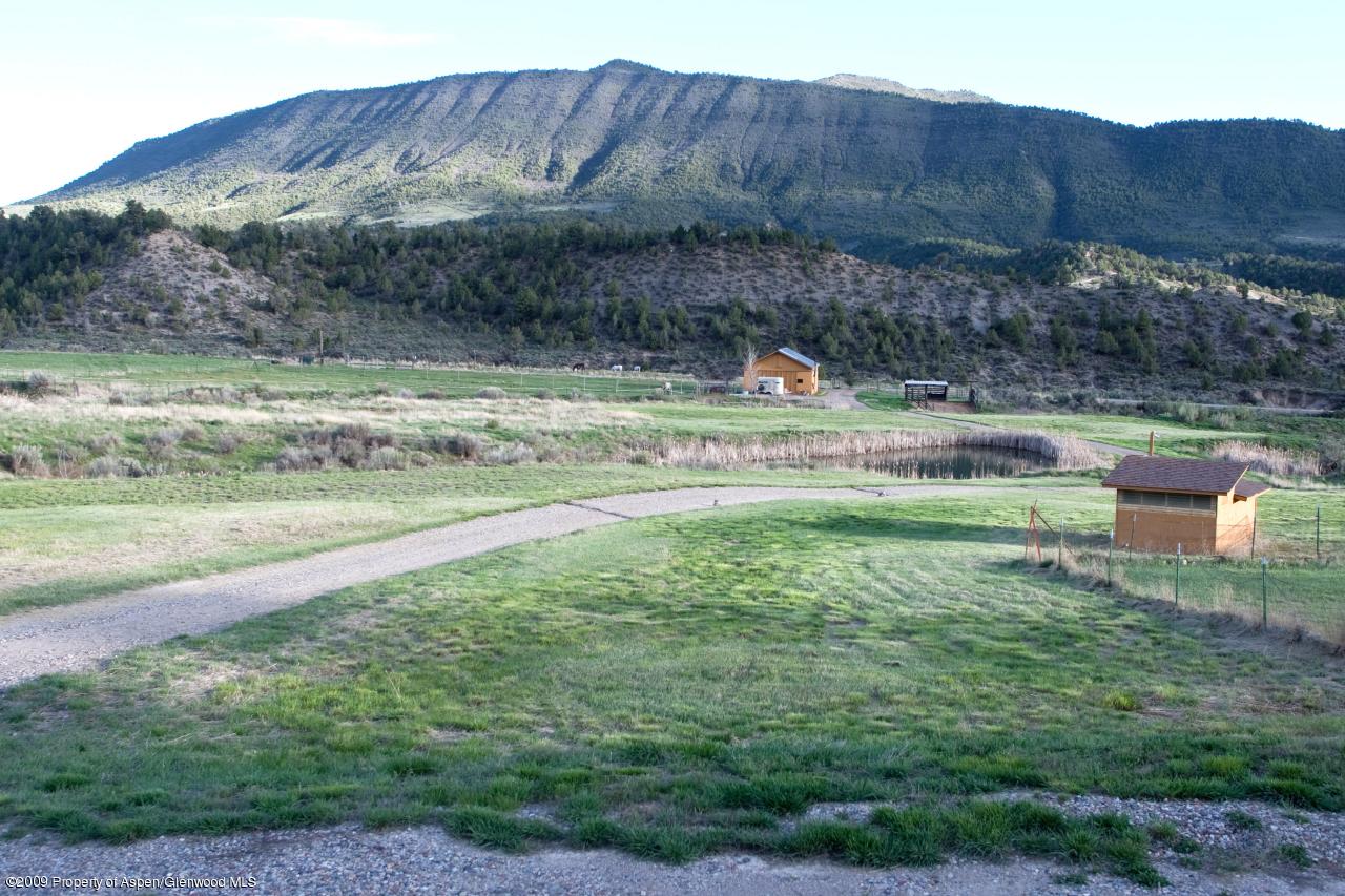 1225 County Road 226 Rifle, CO 81650 - Photo 15 of 22 a view of a house with a yard