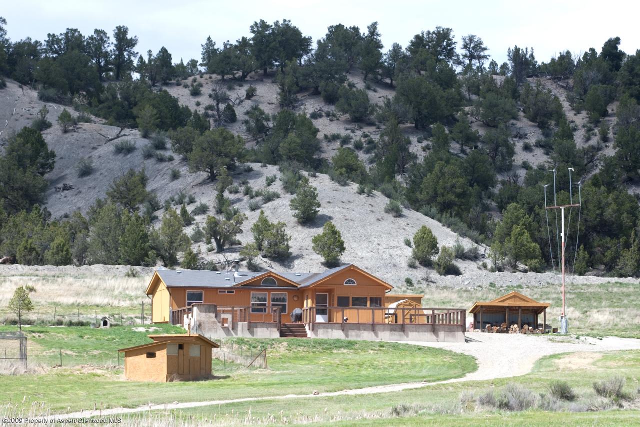 1225 County Road 226 Rifle, CO 81650 - Photo 17 of 22 an aerial view of a house garden and trees